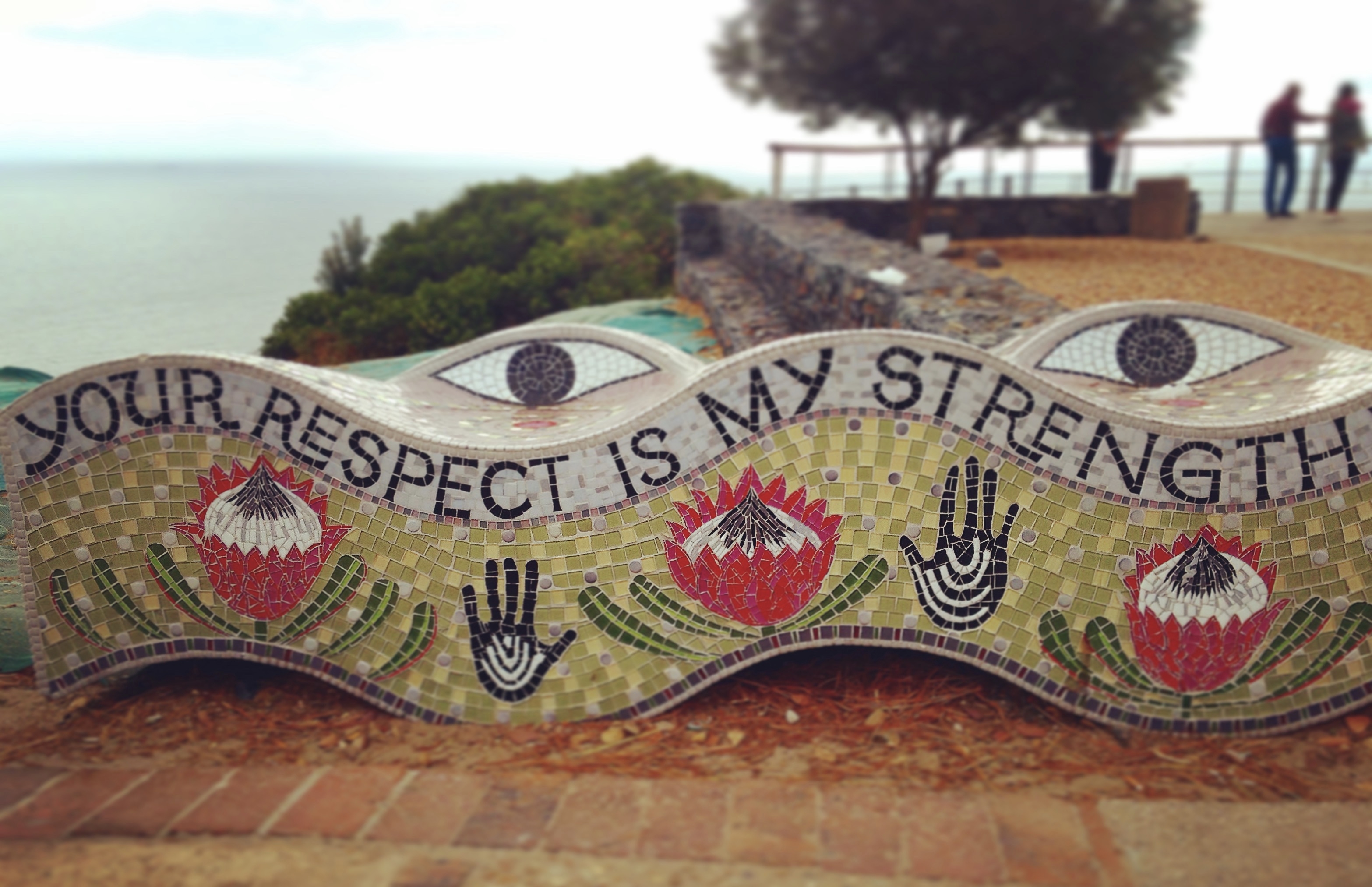 sculpture at top of signal hill that reads "your respect is my strength"